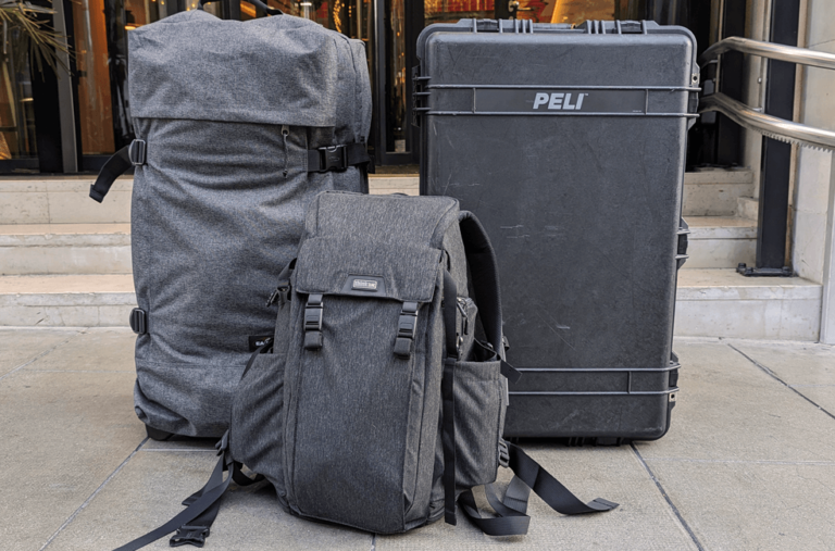 Some baggages on a sidewalk.